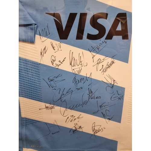 62 - Star Lot : A framed Argentinian Rugby (pumas) Hand Shirt signed by the team. Signed by Hernandez, Ti... 