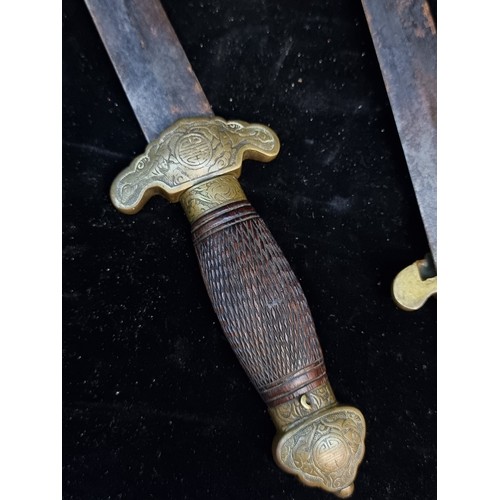 142 - Star Lot : A 19th century Chinese double sword (Shuang Jian) with tortoise shell and brass mounts, e... 