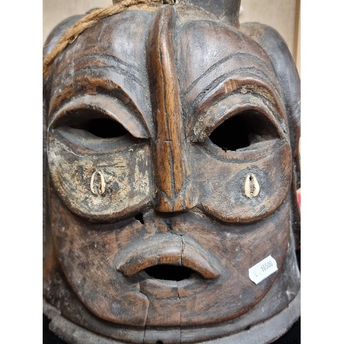 269 - Star Lot : A striking very large 4 sided vintage  African tribal wooden carved mask. Was brought bac... 