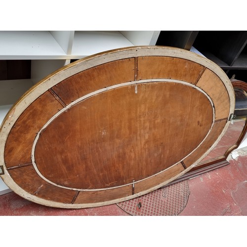 349 - Star Lot : A large  elegant antique  large Rococo style oval 9 panel  bevelled wall mirror in very g... 