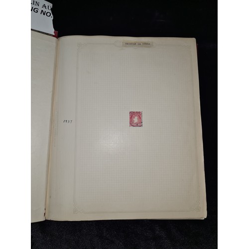 796 - Star Lot : Vintage red stamp album featuring a selection of early Irish Free State stamps. Including... 