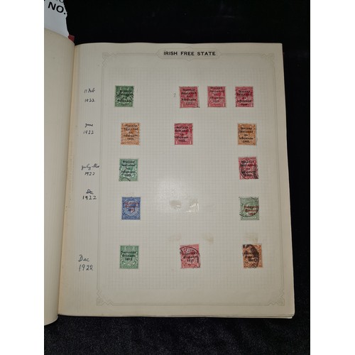 796 - Star Lot : Vintage red stamp album featuring a selection of early Irish Free State stamps. Including... 