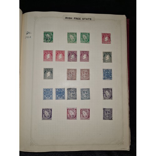 796 - Star Lot : Vintage red stamp album featuring a selection of early Irish Free State stamps. Including... 