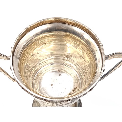 41 - A very nice example of an Irish silver presentation cup with celtic design rim. Cup marked S. H. Wat... 