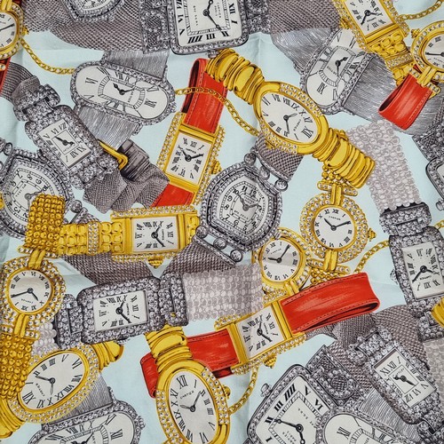 411 - Star Lot : A Cartier silk scarf depicting the companies various watch designs with rolled stitched e... 