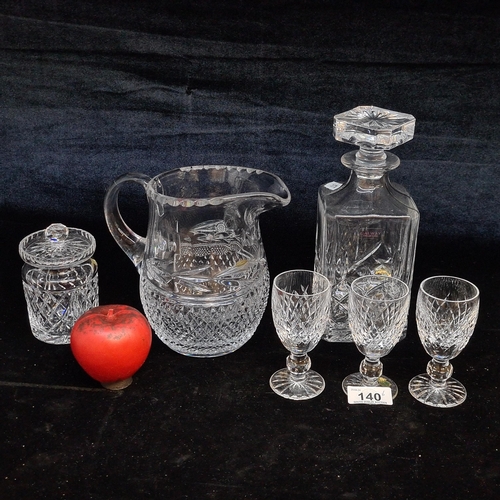 140 - A mixed lot of crystal items including three Waterford Crystal sherry glasses, a Waterford Crystal p... 