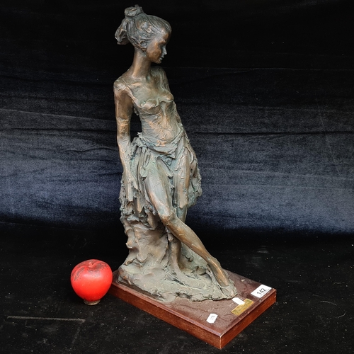 142 - A super heavy large Paul Marcell sculpture sat on a wooden plinth.