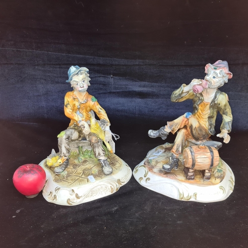 143 - A pair of large whimsical Capodimonte ceramic figures. Stamped to base. One with price tag reading €... 