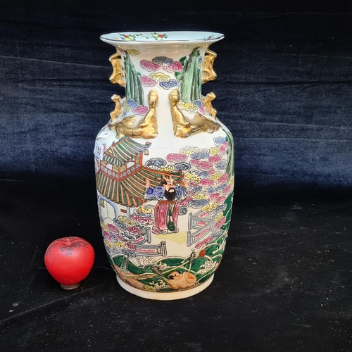 150 - A large vintage Japanese hand painted porcelain vase depicting traditional scenes. A fabulous piece.
