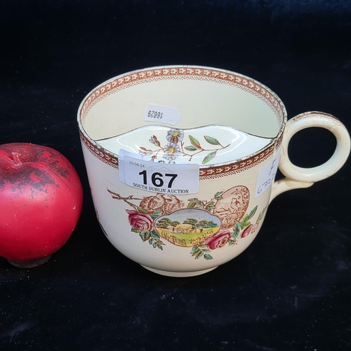 167 - A charming vintage extra large mustache cup with gilt gold rim, handle has been previously repaired.