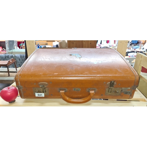 A vintage Victor Luggage brown leather suit case.