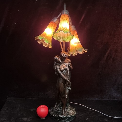 158 - A tall elaborate three tier lamp in the form of a nude male and female figure.