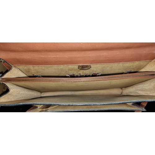 168 - A superb Taxier French made leather briefcase  with three separate compartments, one to fit a laptop... 