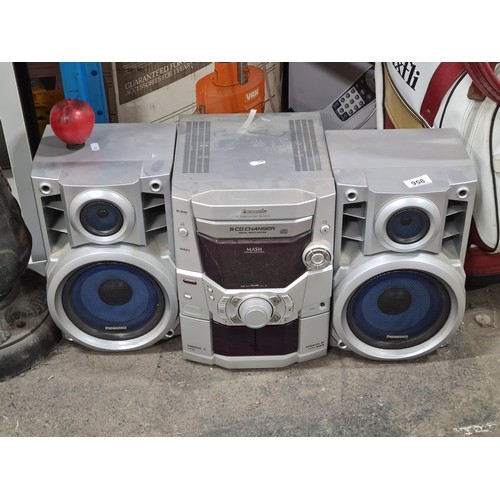 Two 'Panasonic' speakers along with a CD Stereo System SA-AK210.