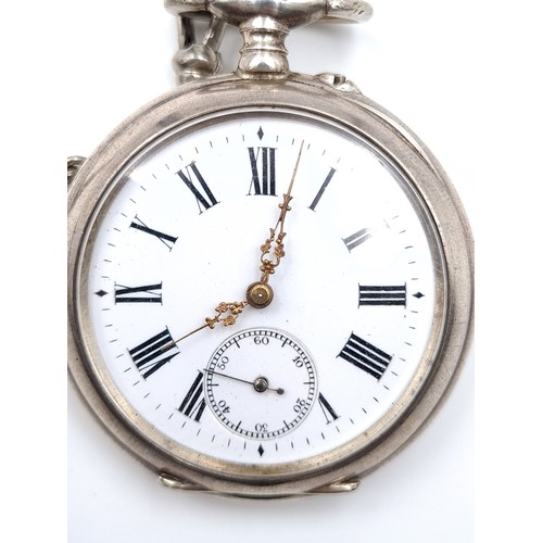 15 - A pocket watch set with white enamel face, roman numeral dial with second hand. Watch has wind-up me... 