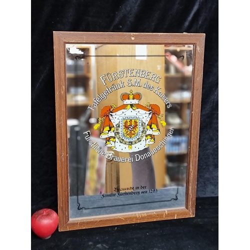 100 - A super 1990's Furstenberg German Beer advertising bar mirror. Housed in a wooden frame.