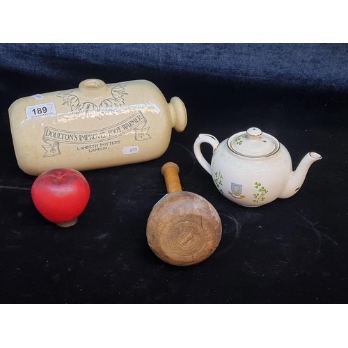 189 - A mixed lot including an antique Doulton's improved foot warmer, an Arklow teapot 'Souvenir of Irela... 