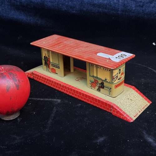 199 - A tin plate Brimtoy painted metal model railroad station platform.