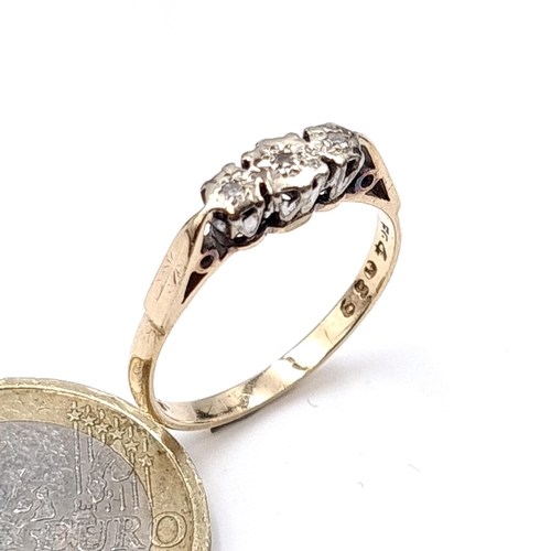 6 - Star Lot : A nine carat gold (375) three stone illusion set vintage diamond ring with crown mount. R... 