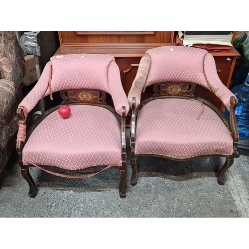 A pair of antique Regency chairs with carved frame and pink diamond-patterned upholstery. Elegant design with string inlay throughout the frame. Some attention needed to upholstery, would be an ideal project. These are fabulous chairs.