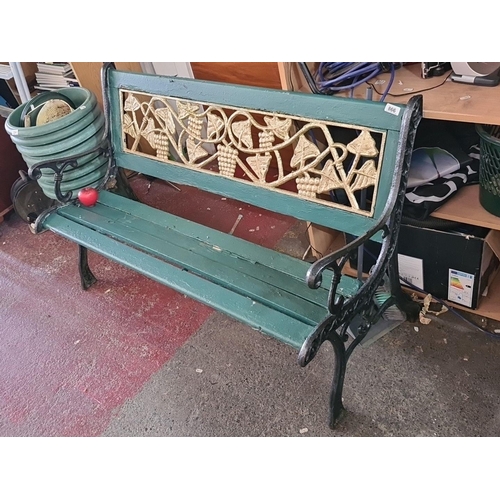 866 - An incredible antique cast iron garden bench with ornate grapevine pattern backrest and wooden slats... 