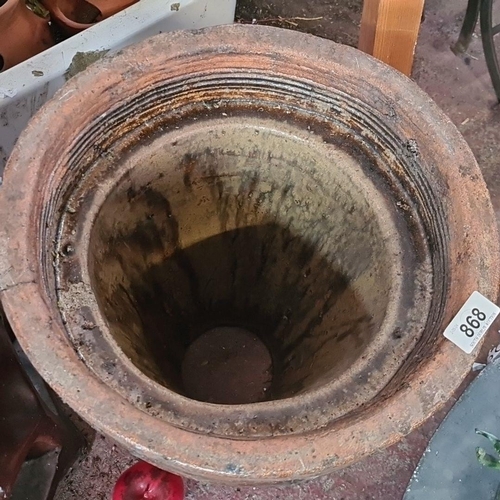 868 - A fabulous vintage Trumpet terracotta  planter, displaying a weathered patina with ribbed detailing,... 