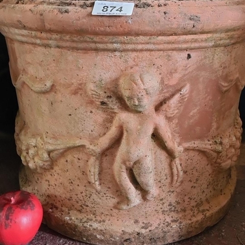 874 - An antique large  terracotta garden planter, featuring relief cherub designs.