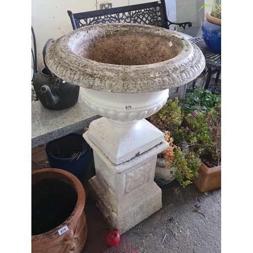 875 - Star lot : A classical-style garden urn on pedestal, stone composition featuring decorative foliage ... 