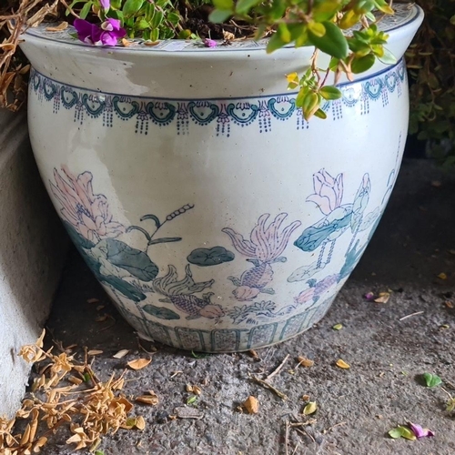 876 - A beautiful chinese-style porcelain planter with elegant floral and aquatic motifs