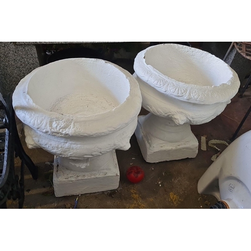 878 - Star lot : A pair of good size classical-style garden urns featuring a white textured finish.