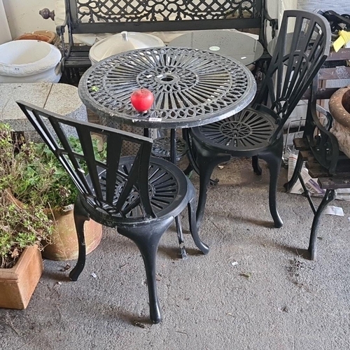 882 - Star lot : A classic style cast iron garden set including a round filigree table and two chairs. A b... 