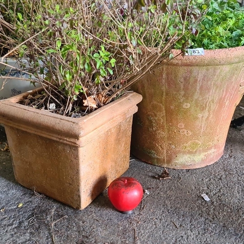 883 - A pair of traditional terracotta plant pots with a lovely aged patina