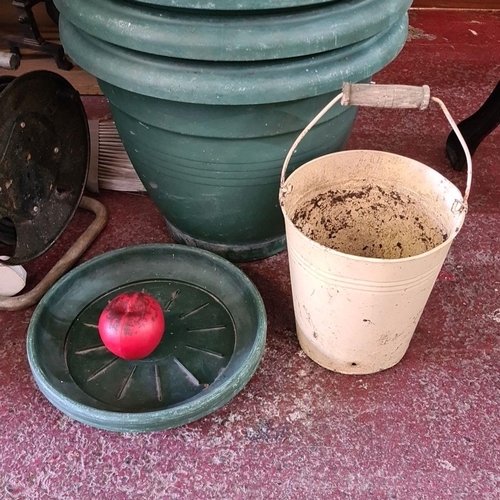 884 - A selection of gardening accessories including eight large green pots with seven matching saucer, al... 