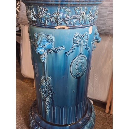 889 - Star Lot : A stunning neoclassical-style ceramic pedestal with high-relief grapevine and classical f... 