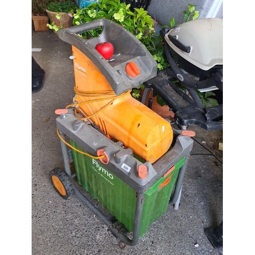 899 - A 'Flymo Pac a Shredder'  garden waste shredder in orange and green, with cable.
RRP: £199.99 on www... 