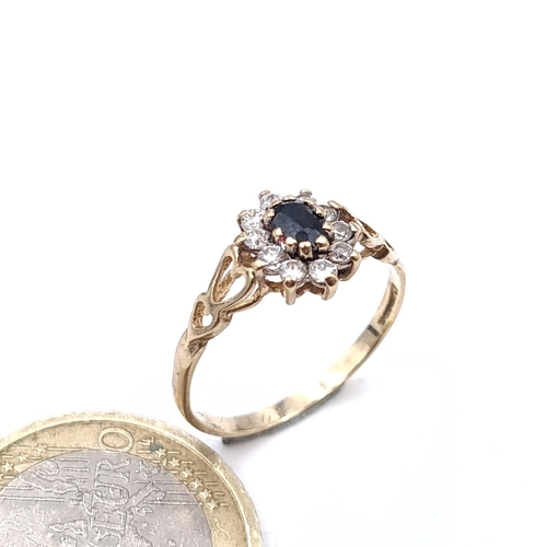 905 - A nine carat gold Sapphire gem set ring. Size - M. Weight - 1.2 grams.