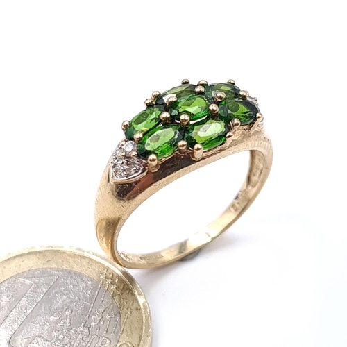 910 - Star Lot: A green tourmaline stone ring with diamond mount set in nine carat gold marked China. Size... 