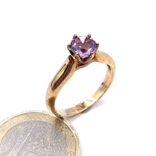 911 - Star Lot: A nine carat gold (375) amethyst stone ring. Size - N. Weight - 3 grams. Boxed.