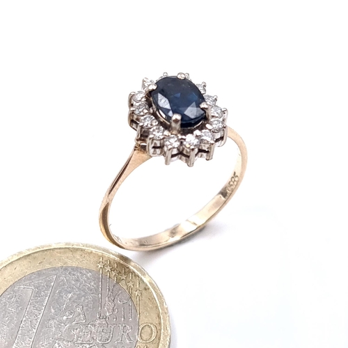 912 - Star Lot: A diamond and sapphire ring set in 14 carat gold marked 585. Size - L. Weight - 2.63 grams... 