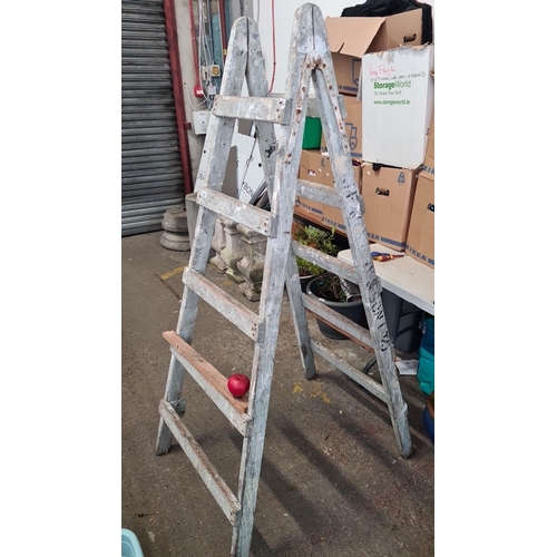 924 - An appealing vintage wooden step ladder with a distressed paint finish