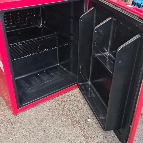 929 - A retro Coca-Cola branded Husky mini fridge, featuring the iconic red with white logo. Compact desig... 