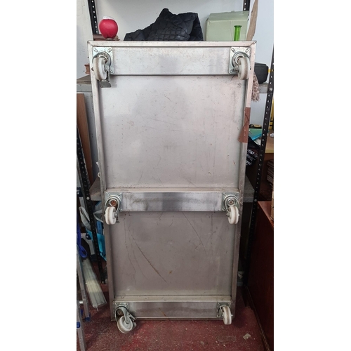 937 - A large industrial-style stainless steel trolley, featuring robust construction and twin-tier design... 