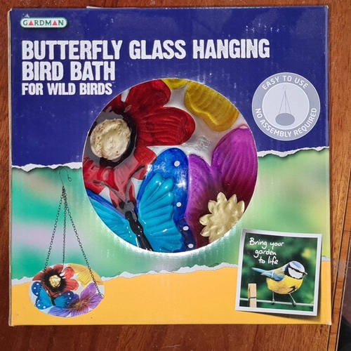 939 - A lot including a new Gardman Butterfly Glass Hanging Bird Bath, along with assorted art auction cat... 