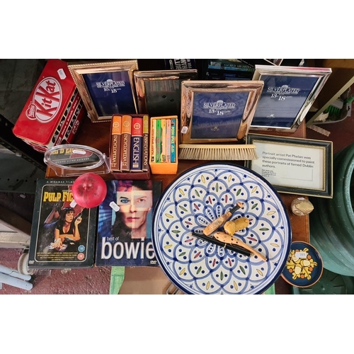 941 - An eclectic mixed lot featuring decorative silver-plated photo frames, a vintage Kit-Kat tin, classi... 