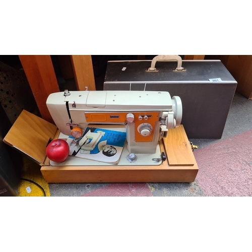 961 - Vintage Brother sewing machine, model 230, in a wooden base with accessory compartment, includes car... 