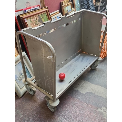 971 - An industrial very heavy duty metal rolling cart with sturdy construction and caster wheels. Was use... 