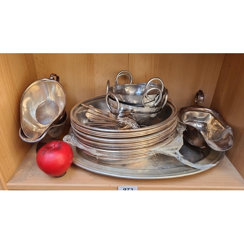 973 - An assortment of stainless  commercial tableware, including trays, serving dishes, gravy boats and f... 