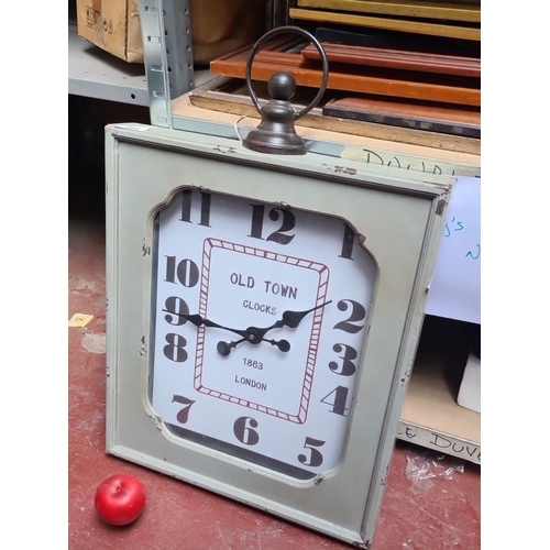 984 - An oversized vintage style square wall clock with a distressed finish, marked 