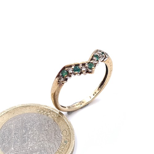 914 - Star Lot: A beautiful 9k gold emerald and diamond ring. Estimated size to diamond 0.2cts. Ring size ... 