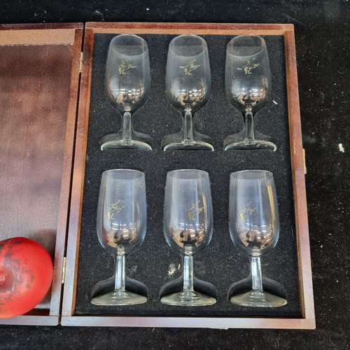 175 - A set of six Rémy Martin glasses packed in a Remy Martin wooden box.